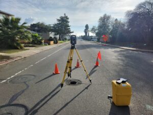 Surveying equipment laid out on a residential street