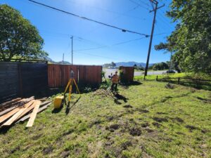 Land surveying in a field under a blue sky
