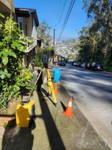 Land surveying on a sidewalk